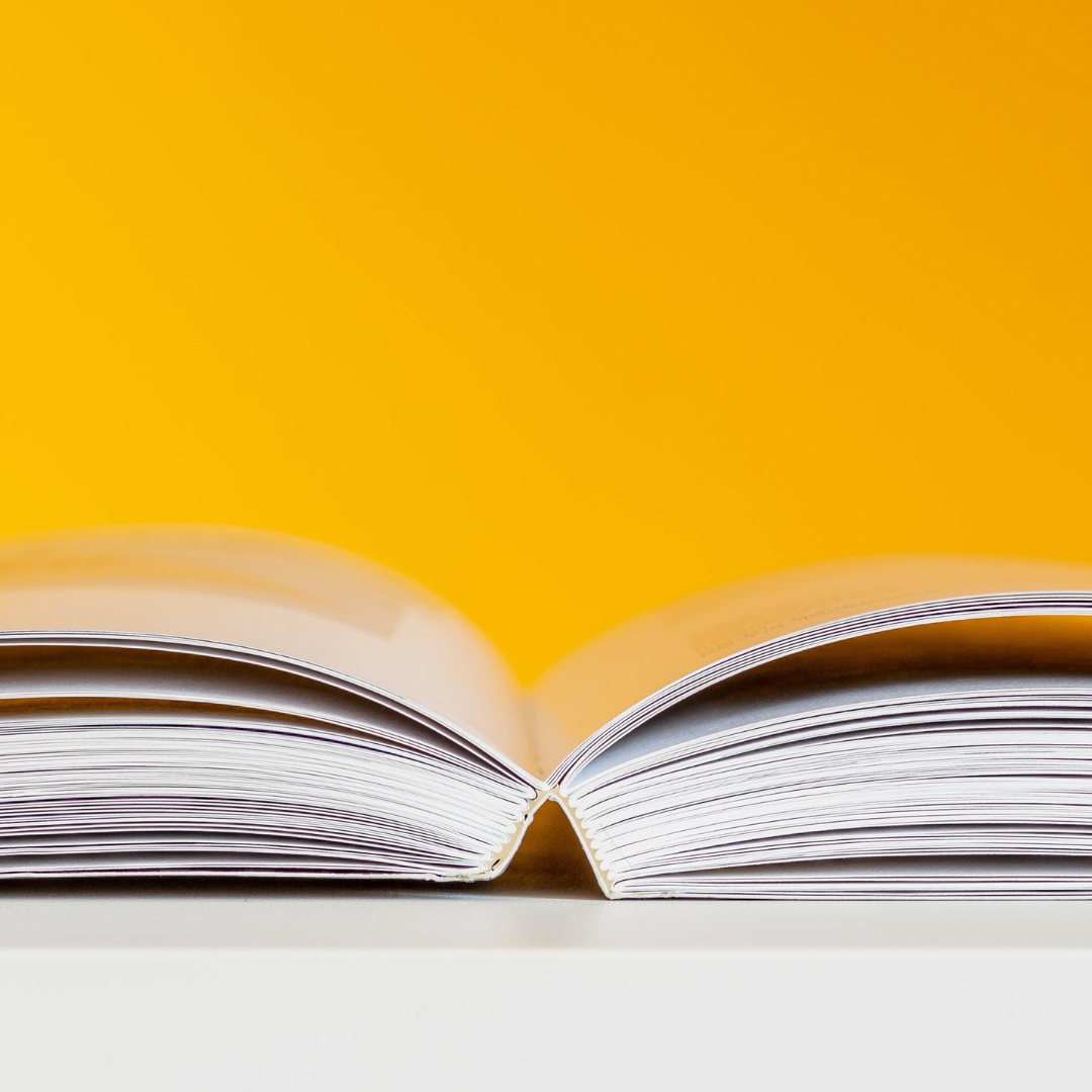 open book against yellow background