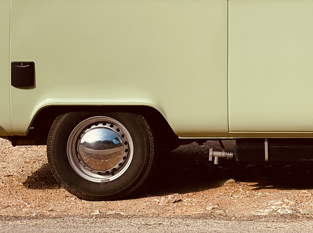 close up of mint green van wheel